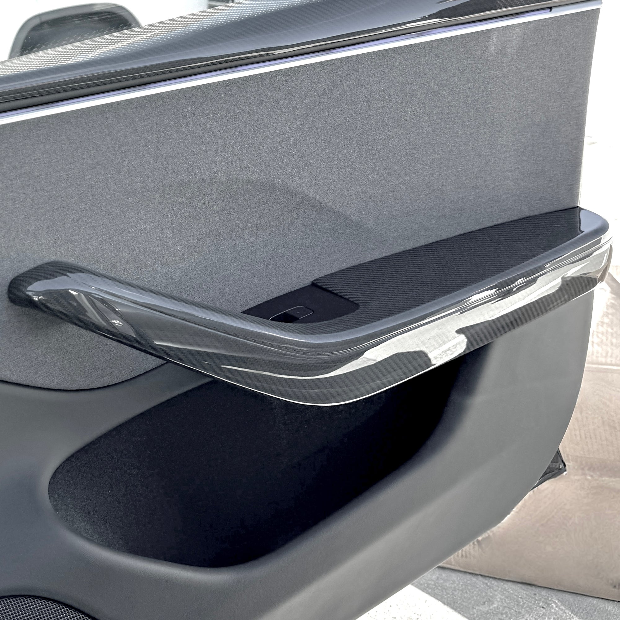 2024+ | Model 3 Highland Refreshed Front & Rear Lower Door Armrest Overlays (4 Pieces) - Real Dry Molded Carbon Fiber
