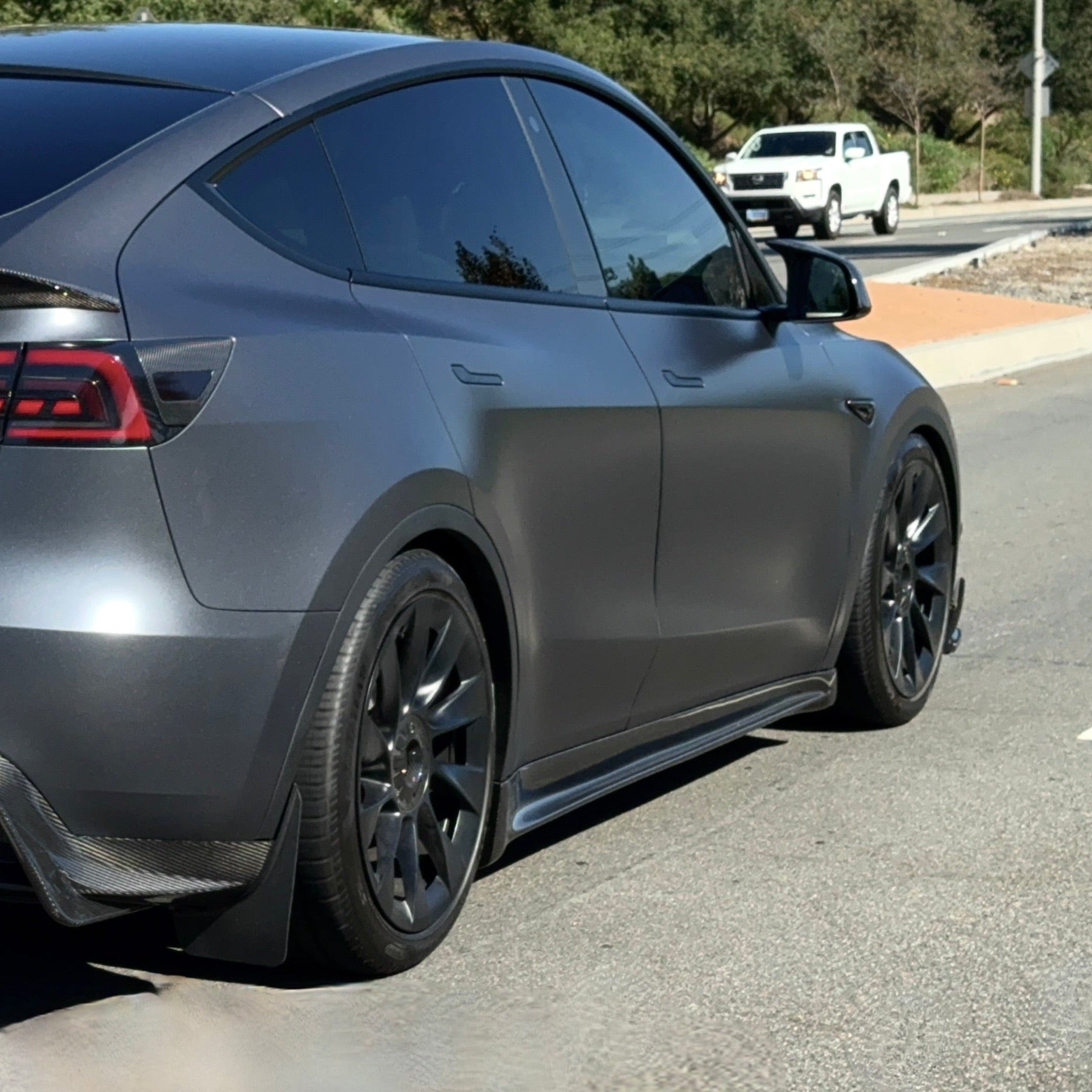 2020+ | Model Y Colossal Side Skirt Overlays - Real Dry Molded Carbon Fiber