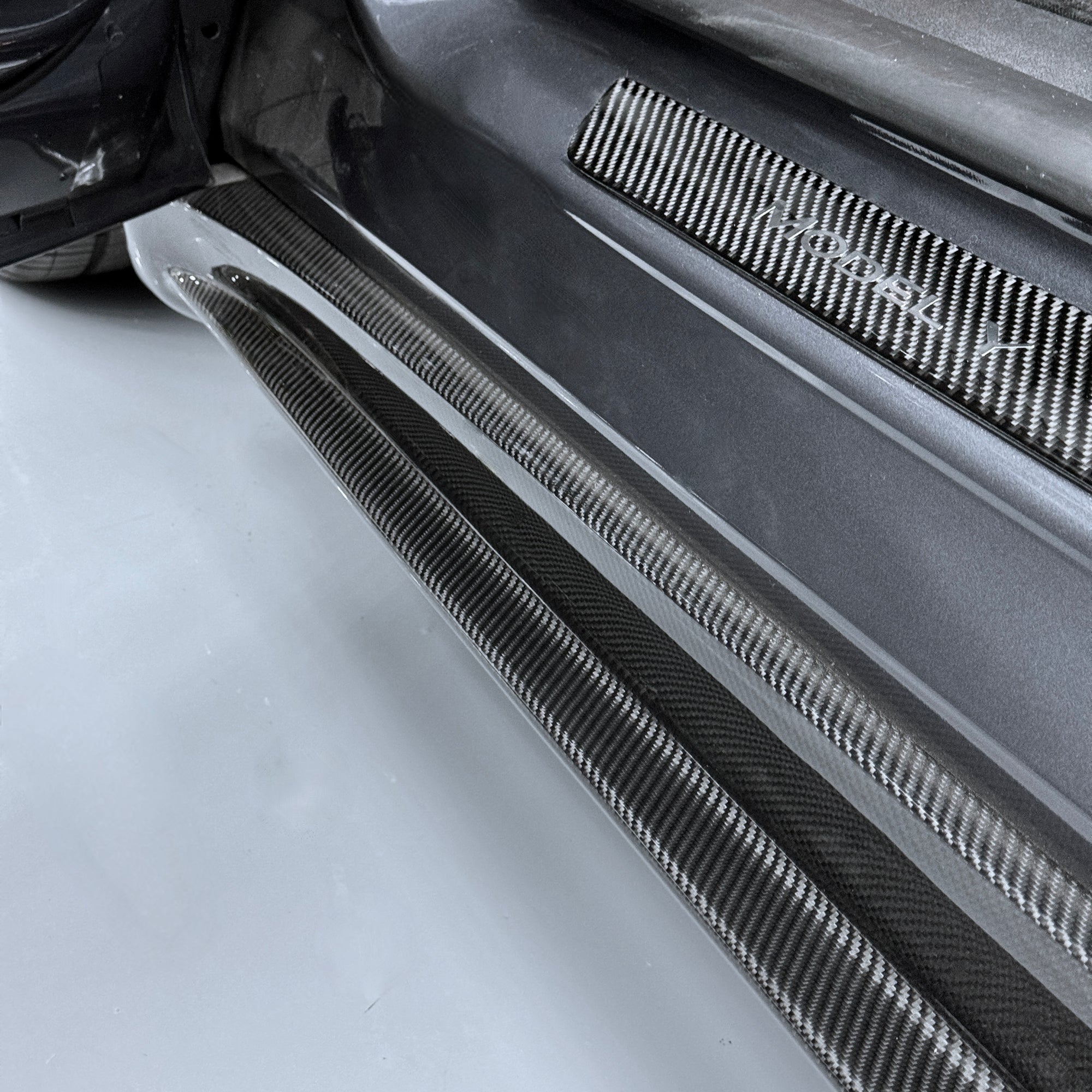 2020+ | Model Y Colossal Side Skirt Overlays - Real Dry Molded Carbon Fiber
