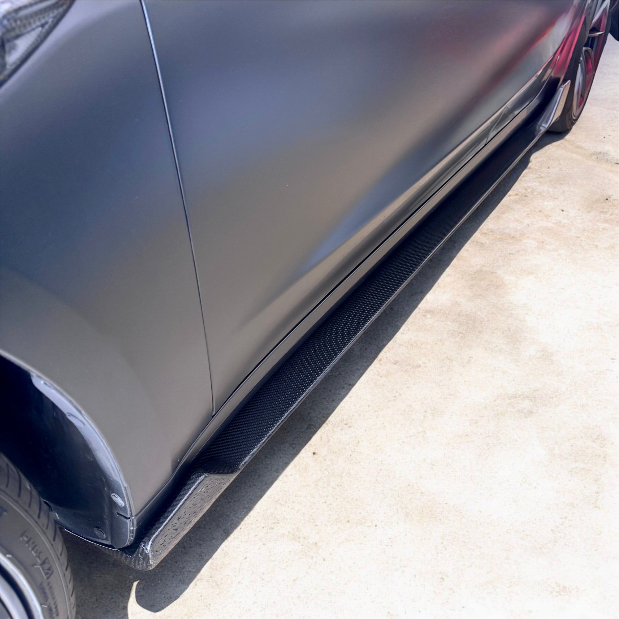 2017+ | Model 3 Colossal Side Skirt Overlays - Real Dry Molded Carbon Fiber