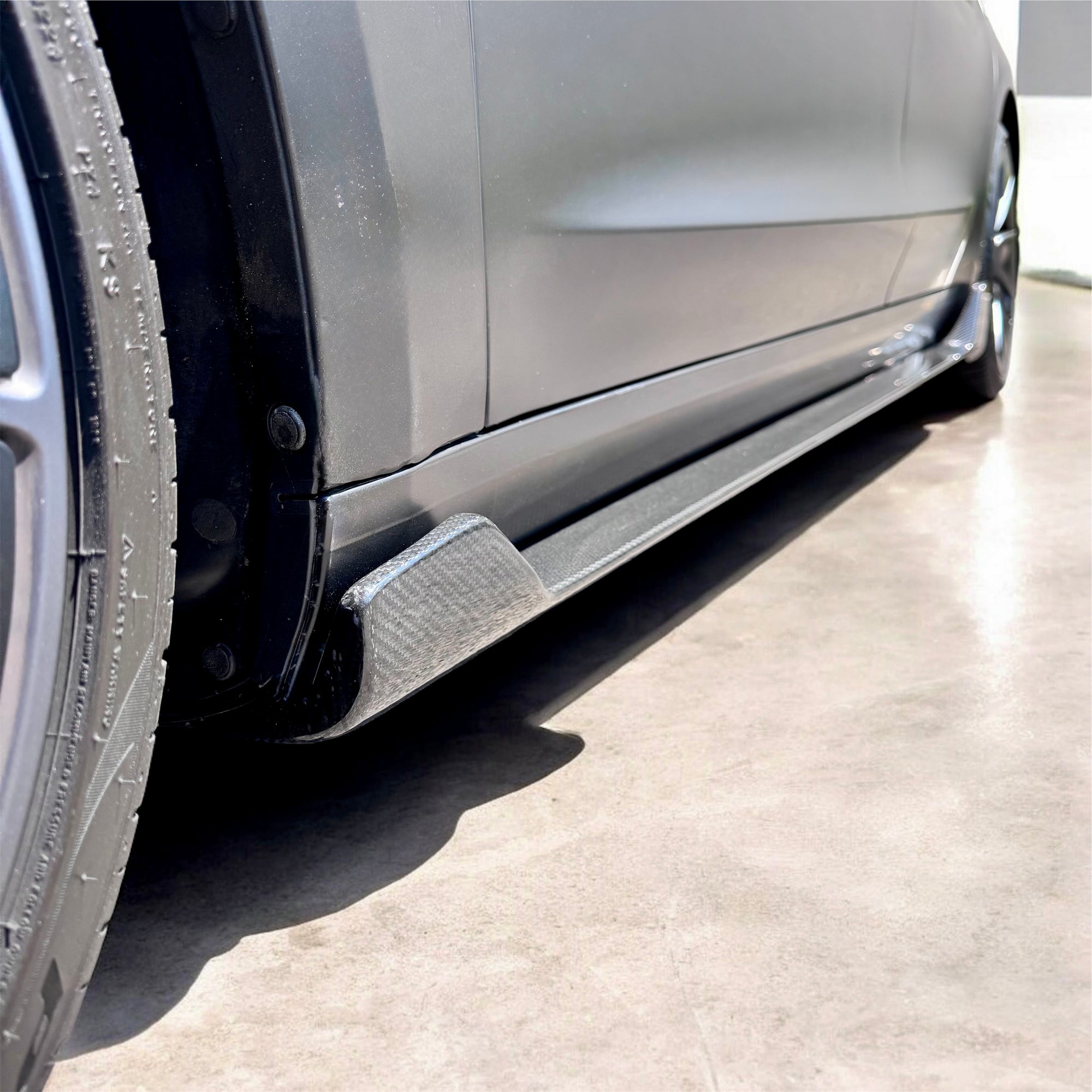 2017+ | Model 3 Colossal Side Skirt Overlays - Real Dry Molded Carbon Fiber